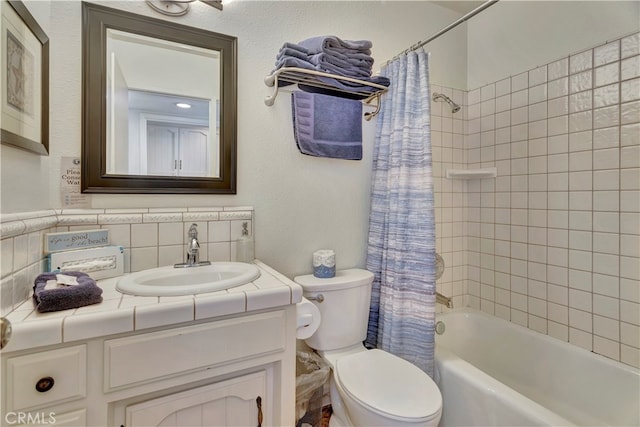 full bathroom featuring tile walls, vanity, shower / tub combo with curtain, and toilet