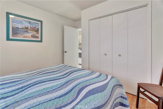 bedroom featuring a closet and light wood-type flooring