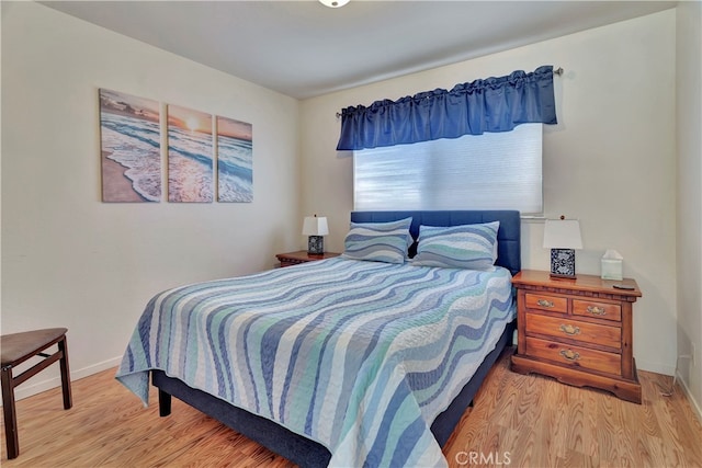 bedroom with light wood-type flooring