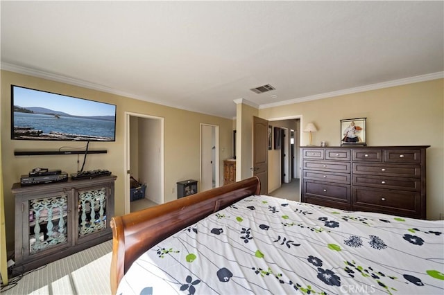 bedroom featuring ensuite bath and ornamental molding