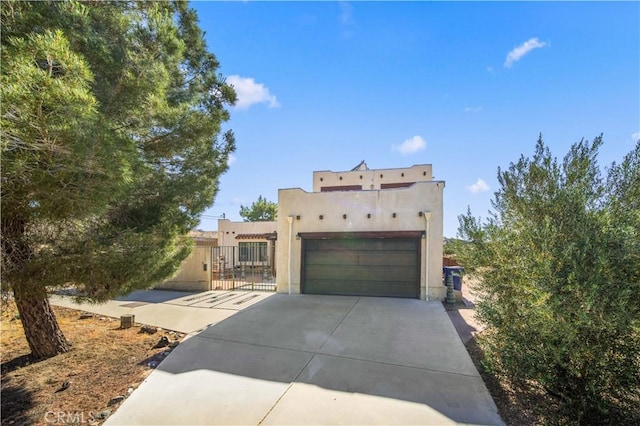 southwest-style home with a garage