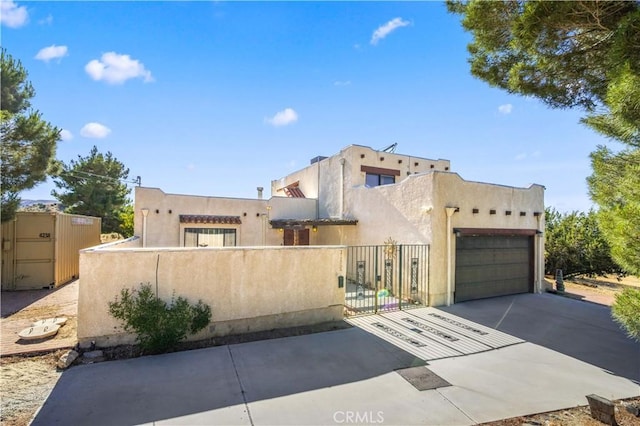 adobe home featuring a garage