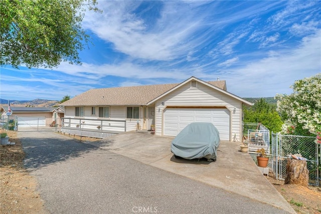51 Apache Cir, Oroville, CA 95966 - ranch-style home featuring fence, driveway, and a garage