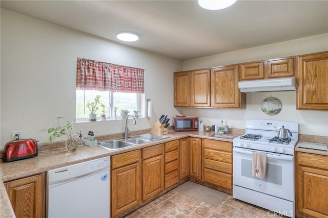 51 Apache Cir, Oroville, CA 95966 - kitchen featuring white appliances, under cabinet range hood, a sink, and light countertops