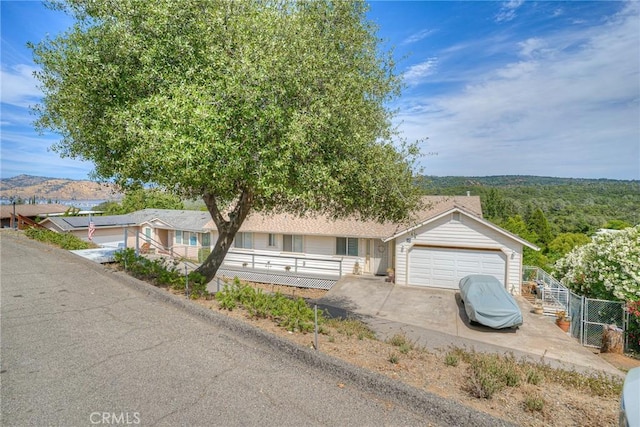 51 Apache Cir, Oroville, CA 95966 - ranch-style house with a gate, driveway, fence, and an attached garage