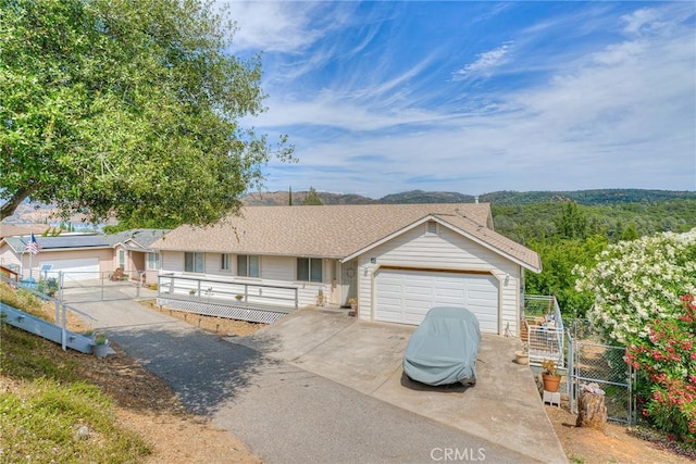 51 Apache Cir, Oroville, CA 95966 - single story home featuring fence, driveway, an attached garage, and a deck