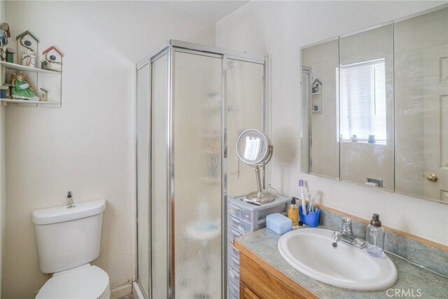 51 Apache Cir, Oroville, CA 95966 - bathroom with a shower stall, vanity, and toilet