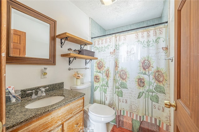 bathroom with vanity, toilet, a textured ceiling, and a shower with curtain