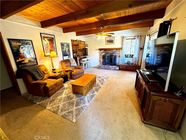 carpeted living room featuring wooden ceiling, beamed ceiling, and a fireplace