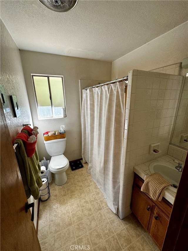 bathroom featuring vanity, toilet, a textured ceiling, and a shower with shower curtain