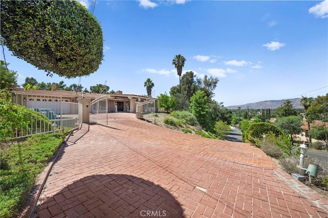 view of front of house with a mountain view and cooling unit