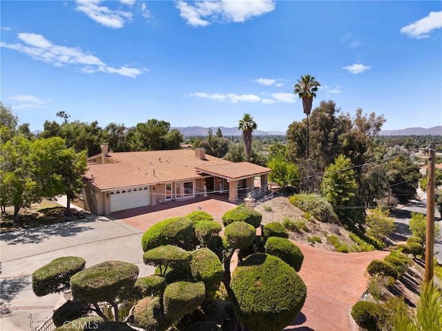 view of front of home featuring a garage and a mountain view