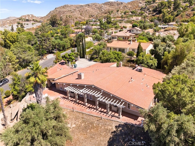 birds eye view of property featuring a mountain view