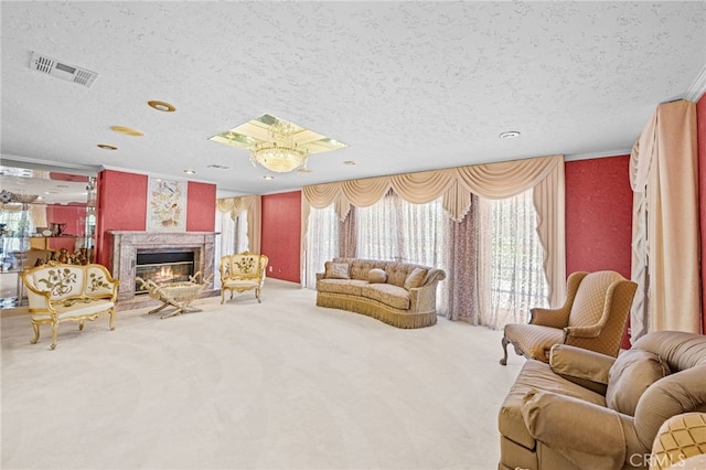 living room with a textured ceiling, a high end fireplace, and carpet