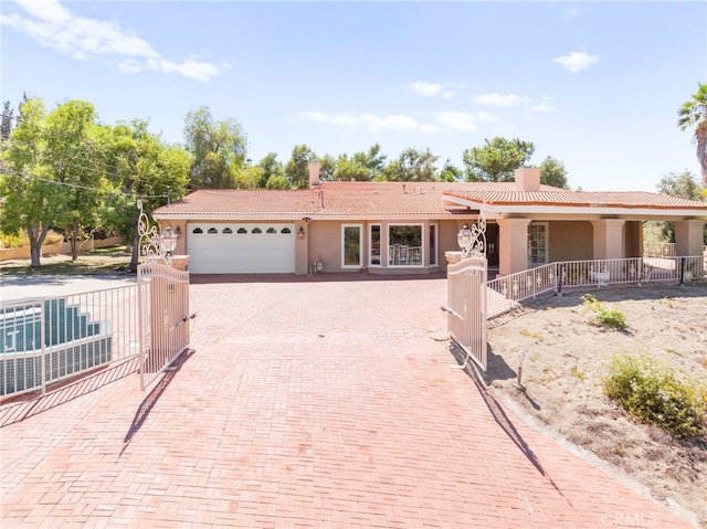 ranch-style home with a garage