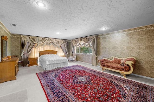 bedroom with crown molding and a textured ceiling