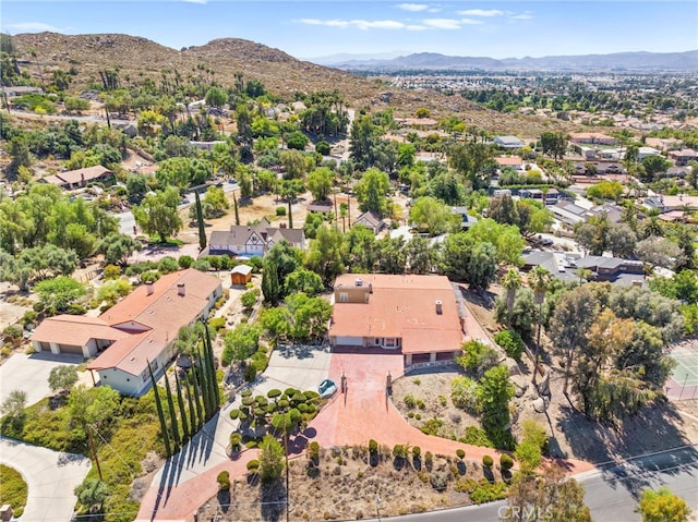 birds eye view of property with a mountain view