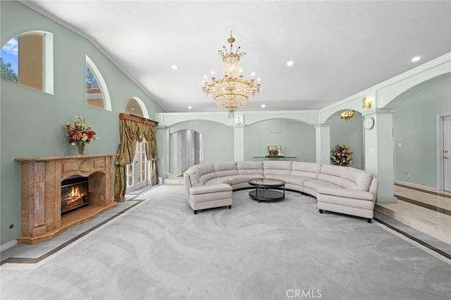 living room with a chandelier and crown molding