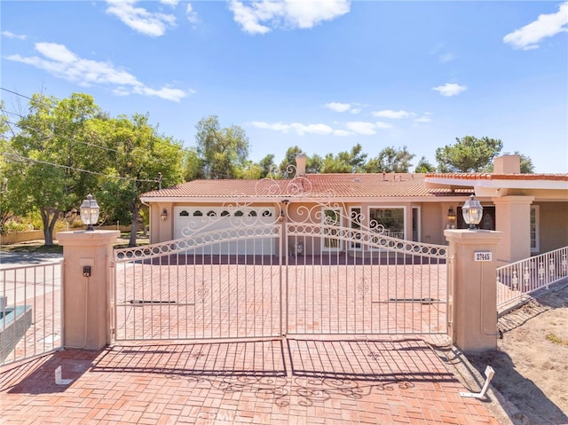 view of front of property with a garage