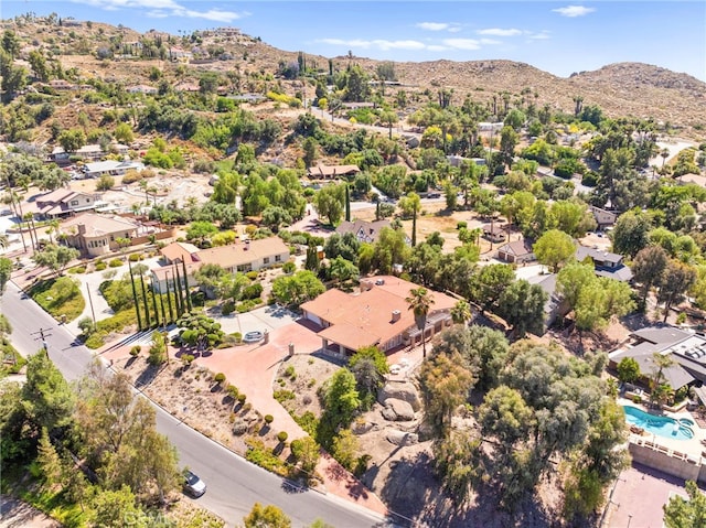 birds eye view of property with a mountain view