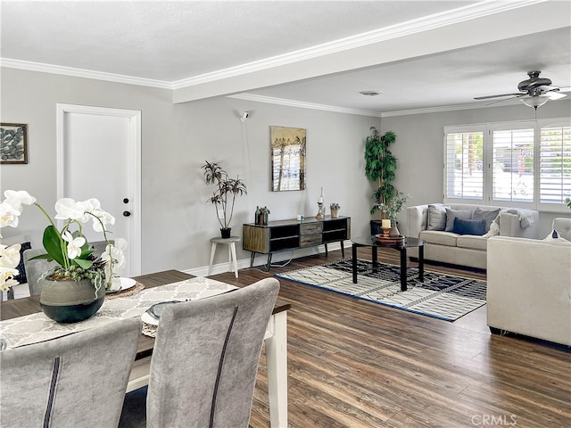 living room with dark wood-type flooring, crown molding, and ceiling fan