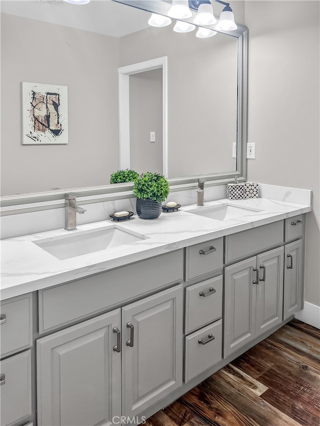 bathroom with vanity and hardwood / wood-style floors