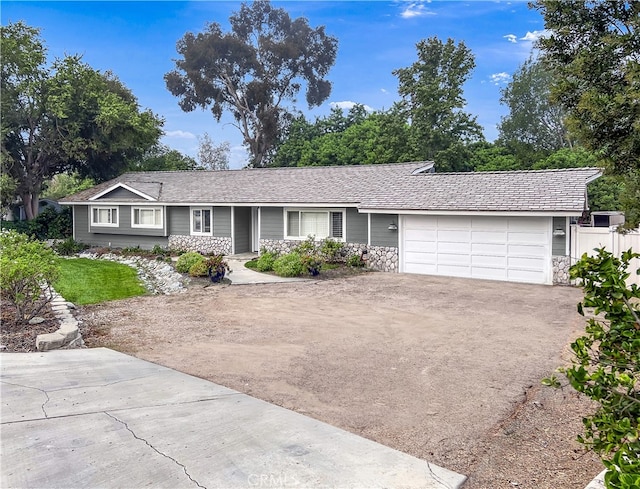 single story home featuring a garage