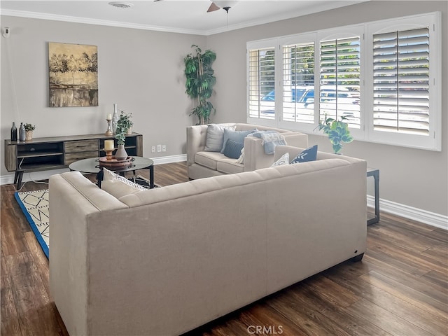 living room featuring ornamental molding, dark wood-type flooring, and ceiling fan