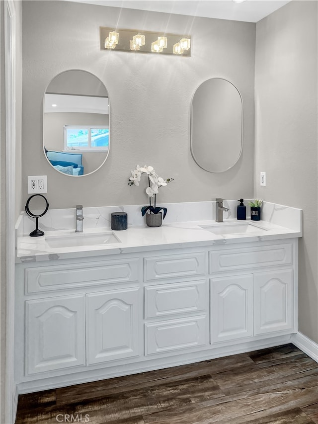 bathroom with vanity and hardwood / wood-style floors