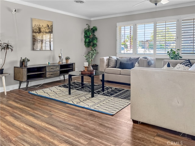 living room with ornamental molding, hardwood / wood-style flooring, and ceiling fan