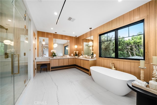 bathroom featuring plus walk in shower, tile flooring, wood walls, and vanity