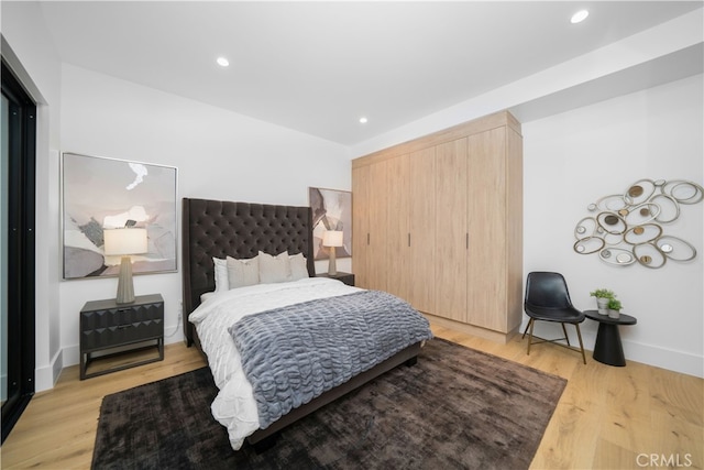 bedroom featuring light hardwood / wood-style flooring