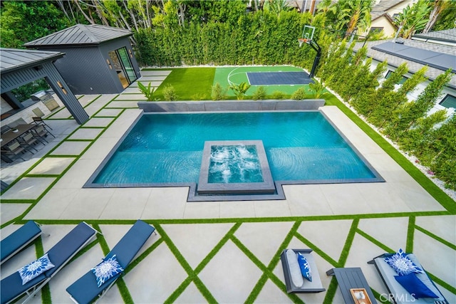 view of pool featuring a patio area