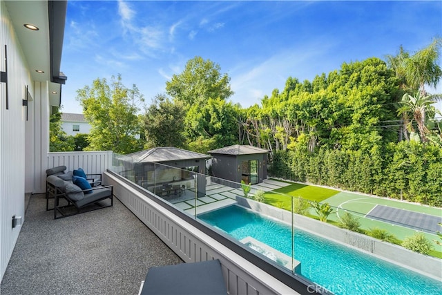 view of swimming pool with outdoor lounge area