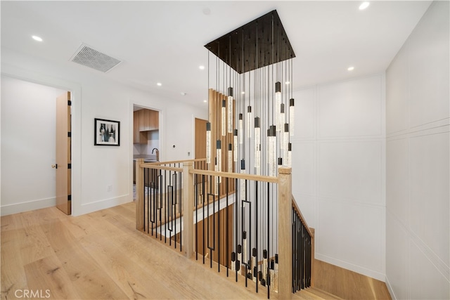 corridor featuring light hardwood / wood-style flooring