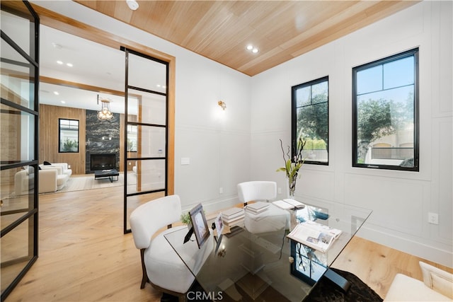 dining area featuring plenty of natural light and light hardwood / wood-style flooring