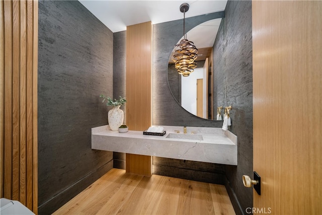 bathroom with hardwood / wood-style floors