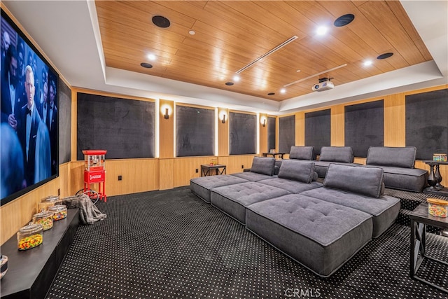 cinema room featuring a tray ceiling and wood ceiling