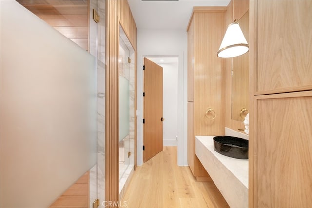 bathroom featuring independent shower and bath and wood-type flooring