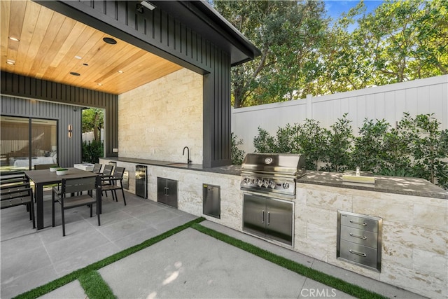 view of patio / terrace with sink, area for grilling, and grilling area