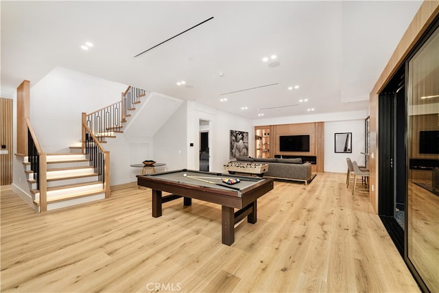 recreation room with light hardwood / wood-style floors and pool table