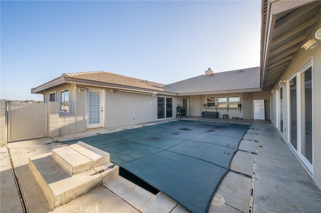 view of pool with a patio and grilling area