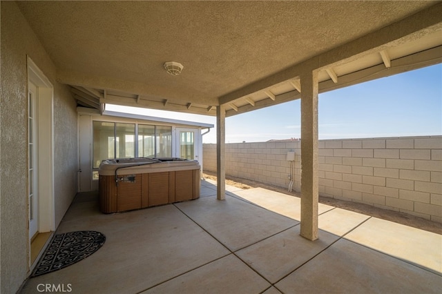 view of patio / terrace featuring a hot tub