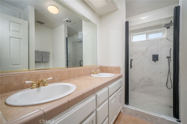 bathroom with vanity, tile patterned floors, and an enclosed shower