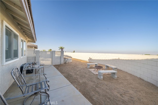 view of patio / terrace featuring an outdoor fire pit