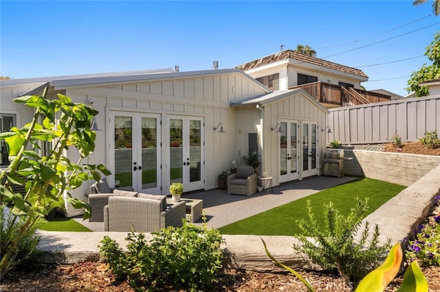 back of house with a patio area and french doors