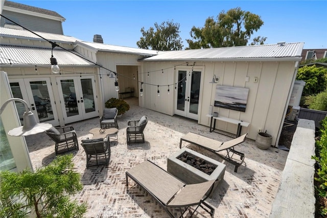 back of property with french doors, a patio, and outdoor lounge area