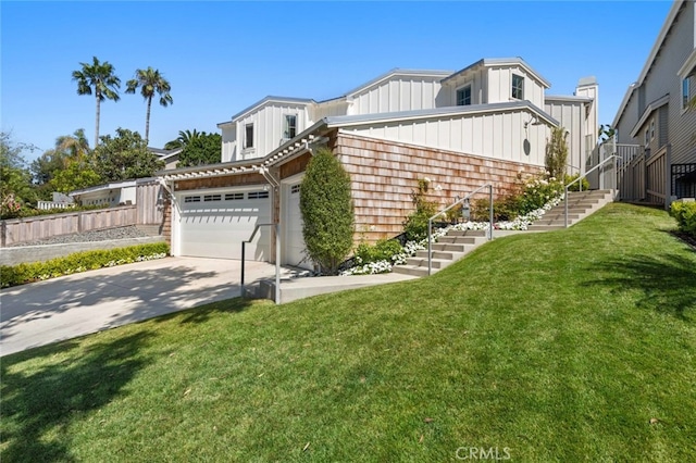 view of side of home featuring a yard and a garage