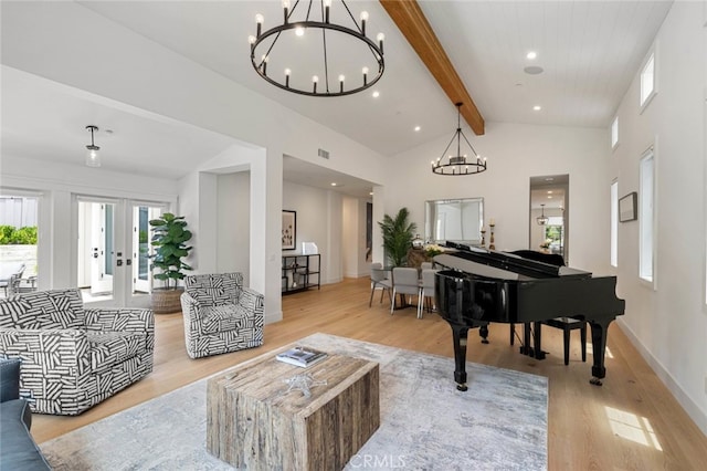 sitting room with french doors, high vaulted ceiling, beamed ceiling, and light hardwood / wood-style flooring