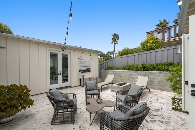 view of patio / terrace with french doors and an outdoor living space